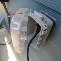 Lid at the 'weatherproof in use' cover at the exterior receptacle is installed upside down. exterior receptacle cover upsidedown